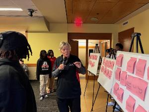 Linda discusses how sticky notes are organized on whiteboards